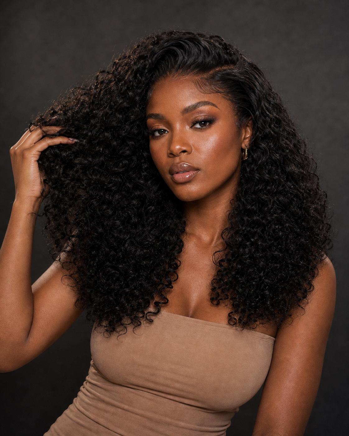 Model wearing defined curly black hair